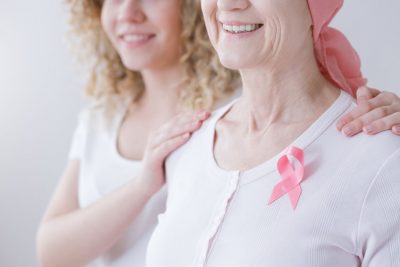 Women with cancer supported by daughter