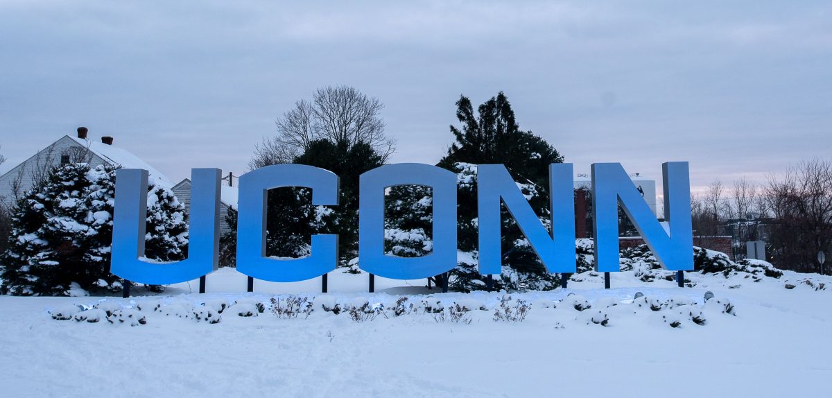 Large UConn sign after a snow storm on Dec. 18, 2020. (Sean Flynn/UConn Photo)