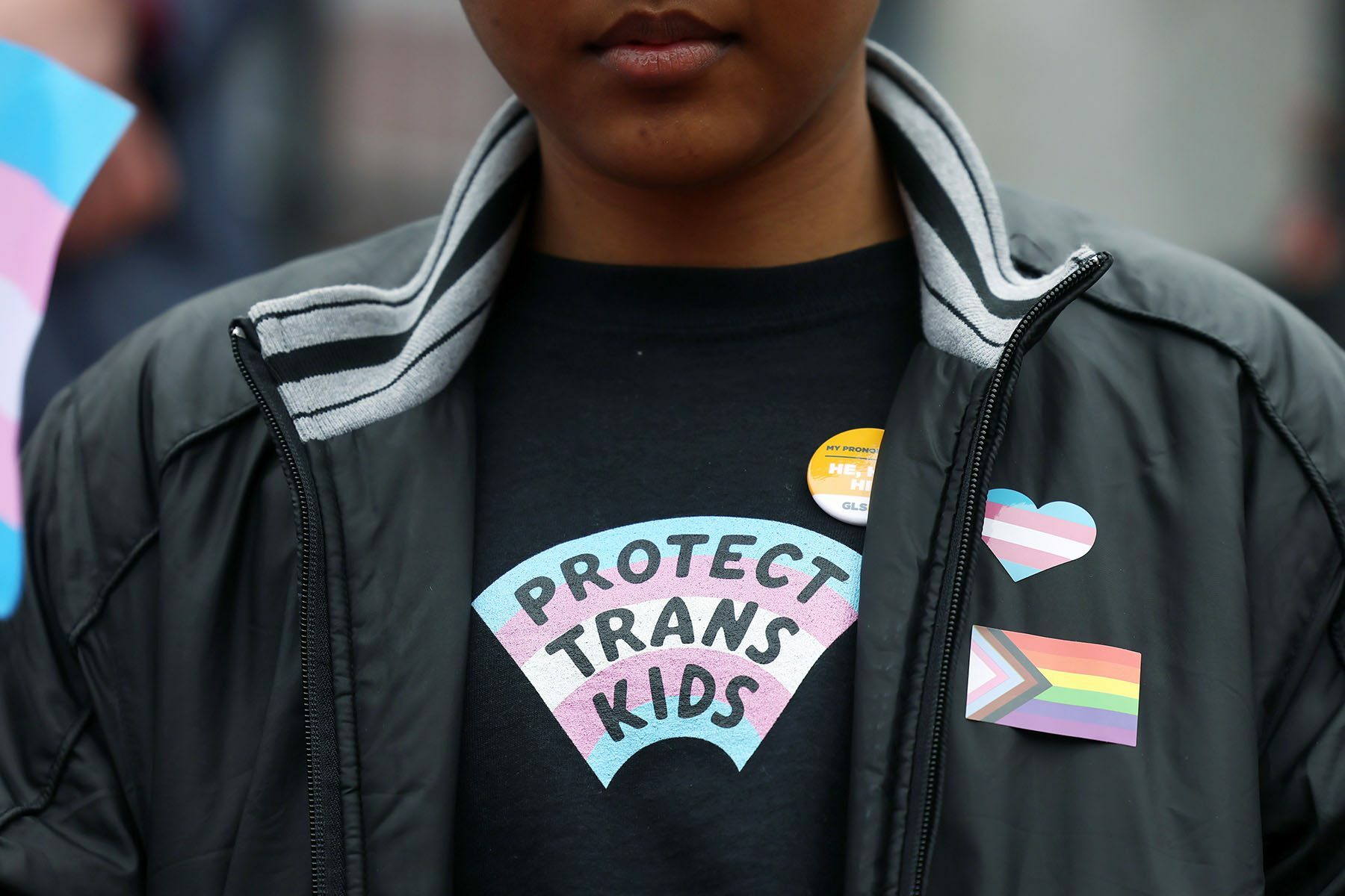 Image of person wearing a shirt that reads, "Protect Trans Children"