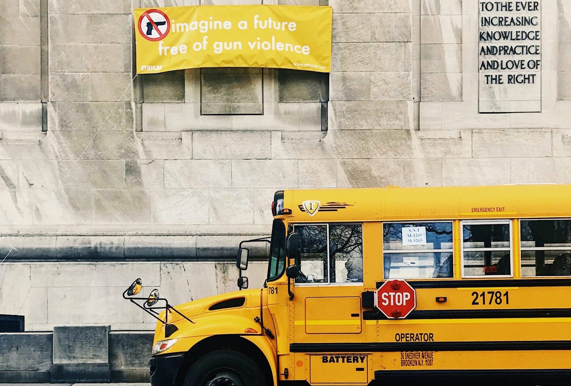 Image of school bus and sign reading, "Imagine a future free of gun violence."